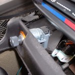 Center console pulled out to access back of cigarette lighter