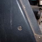 Center console front screw, passenger side